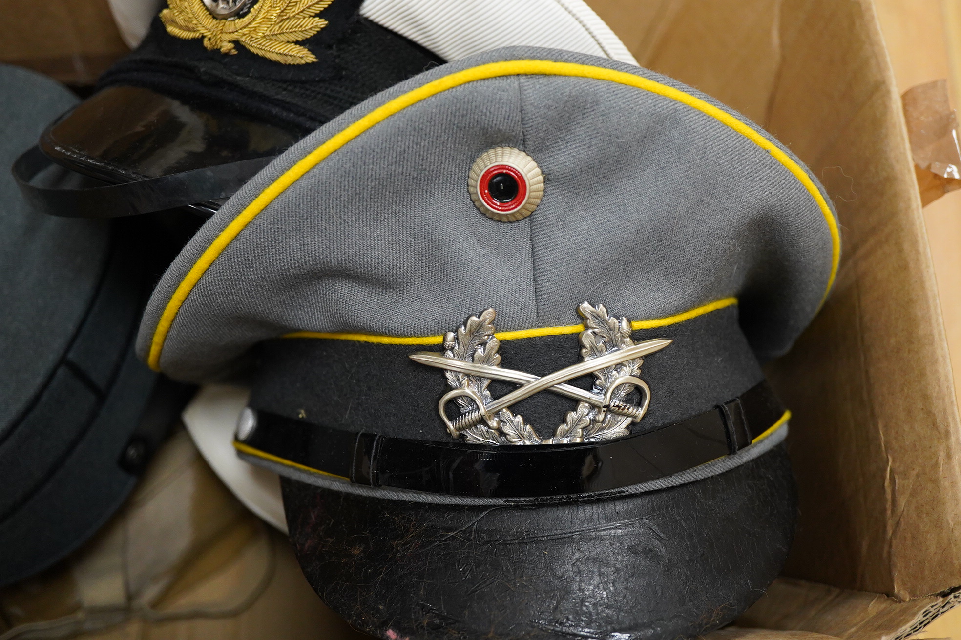 A collection of military and military style caps